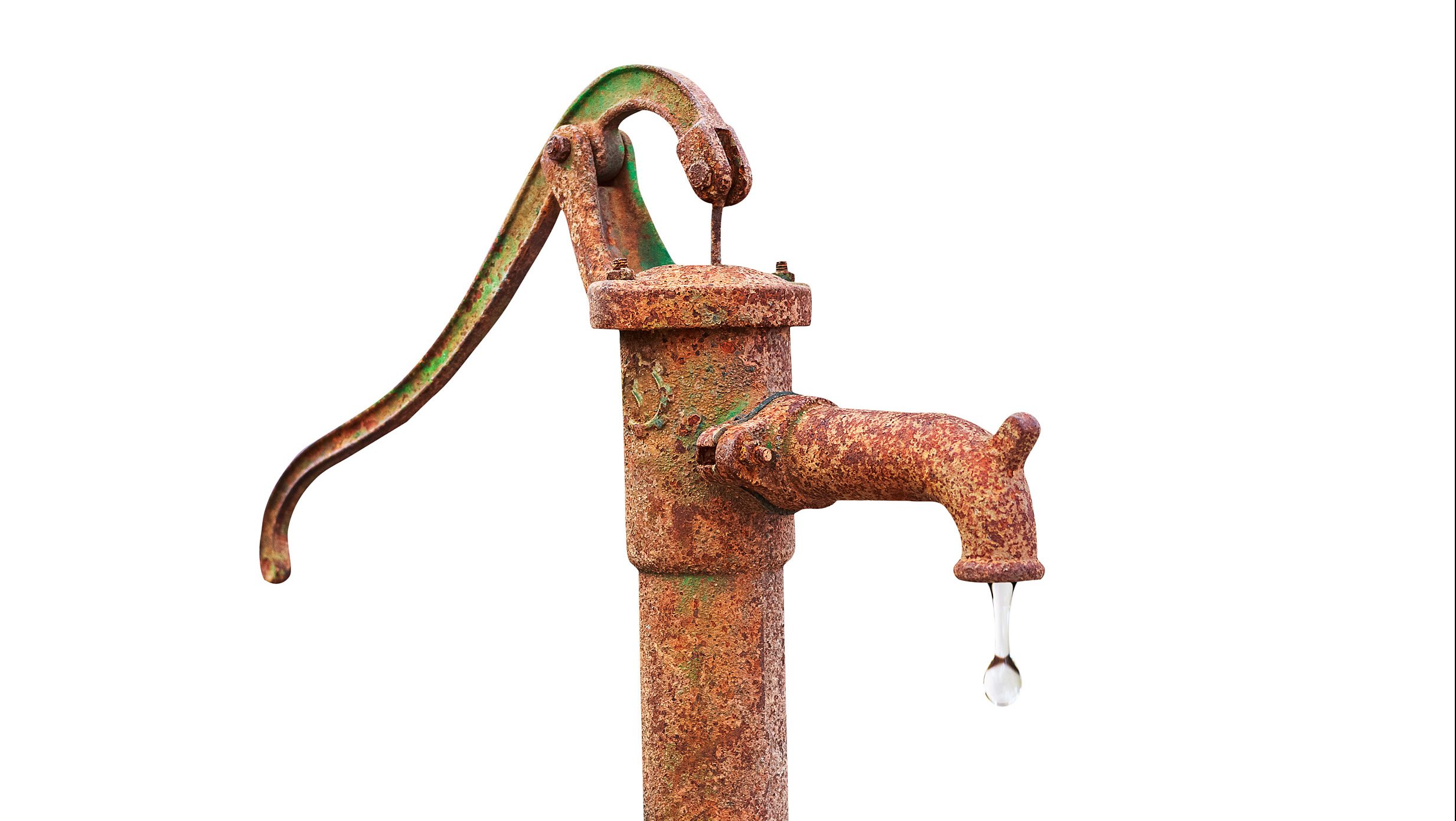 A old rusted water pump isolated on a white background. Rusty water pump.