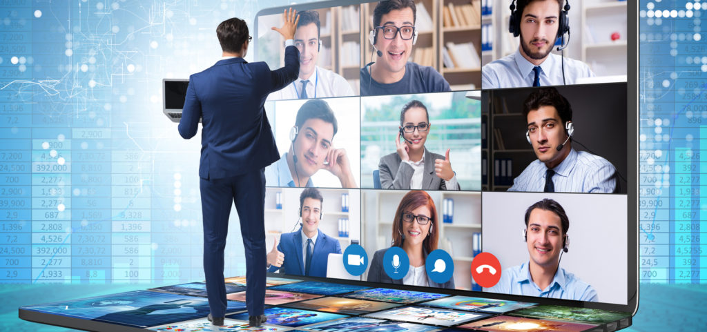 man stand in front of webinar screens